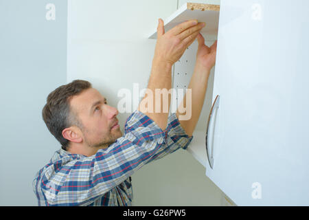 Raccordo del lavoratore una cucina Foto Stock