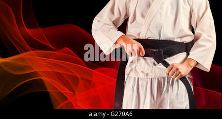 Immagine composita della sezione intermedia del fighter di serraggio della cinghia di karate Foto Stock