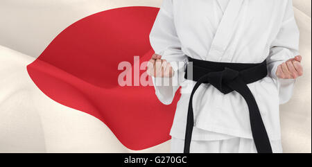 Immagine composita di atleta femminile in posa di kimono Foto Stock