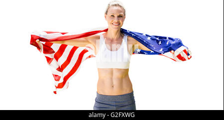 Ritratto di sorridere sportive in posa con una bandiera americana Foto Stock