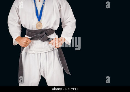Immagine composita del fighter in posa con medaglia intorno al suo collo Foto Stock