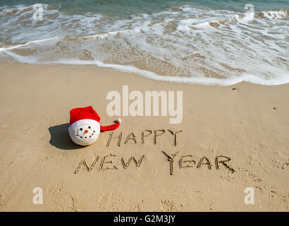 Felice anno nuovo scritto nella sabbia Foto Stock