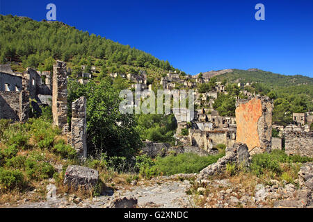 Vista parziale del 'villaggio fantasma' di Kayakoy Lycia, Provincia di Mugla, Turchia. Foto Stock