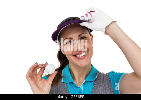 Giocatore di Golf in posa con la pallina da golf Foto Stock