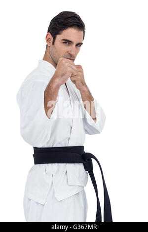Fighter eseguendo il karate posizione Foto Stock