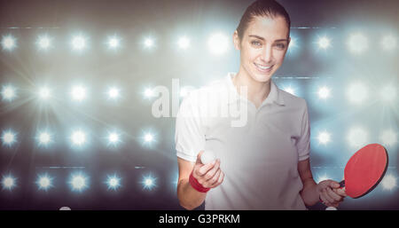 Immagine composita di atleta femminile in posa con ping pong racket Foto Stock