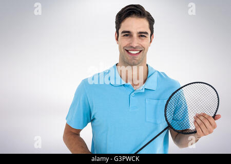 Immagine composita di badminton player holding badminton racchetta Foto Stock