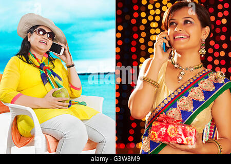 2 persone adulto donna figlia Diwali regalo telefono cellulare montaggio madre sorridente parlare Foto Stock