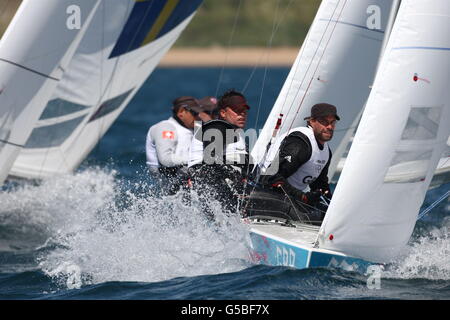 Andrew Simpson (a sinistra) e Iain Percy (a destra) della Gran Bretagna gareggiano nella Men's Star Sailing il secondo giorno delle Olimpiadi di Londra del 2012. Foto Stock