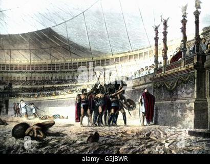 Mit dem Ruf " Ave Caesar! Morituri te salutant!' begüßen die Gladiatoren im Kolosseum in Rom den Kaiser. Il Gladiatori saluto l'imperatore al Colosseo di Roma, Italia. Foto Stock