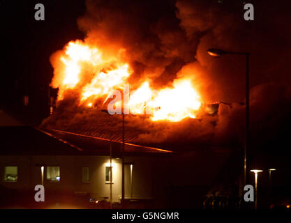 Fuoco a Yarl del legno in centro di asilo Foto Stock