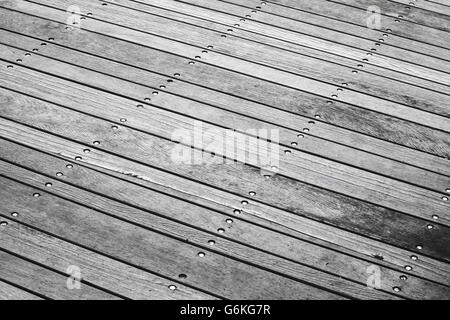 Pavimento grigio fatto di tavole di legno, foto di sfondo con il fuoco selettivo Foto Stock