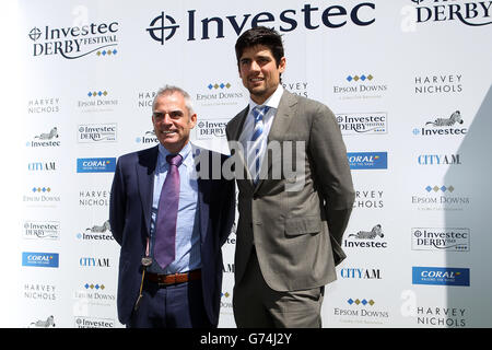 Corse di cavalli - Investec Ladies Day 2014 - Ippodromo di Epsom Downs. Il golfista Paul McGinley (a sinistra) e il capitano del cricket inglese Alastair Cook il giorno delle Signore all'ippodromo di Epsom Downs Foto Stock