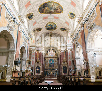 Interno barocco della chiesa cattolica romana Schottenstift, Abbazia scozzese, nel centro della città vecchia di Vienna, Austria Foto Stock