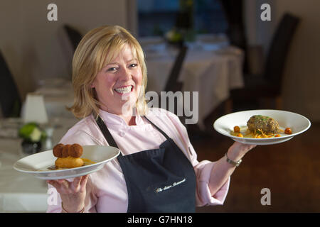 Chef con haggis Foto Stock