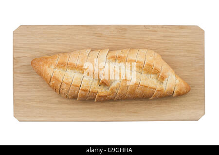 La ciabatta bianca il pane tagliato a fette sulla tavola di legno isolato su sfondo bianco Foto Stock