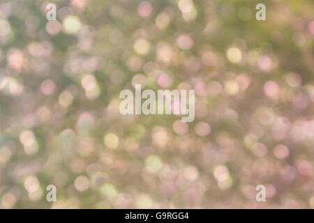 Scintilla colorati e soffiare bokeh di fondo naturale nella meravigliosa fantasia rosa e giallo verde sfondo pastello Foto Stock