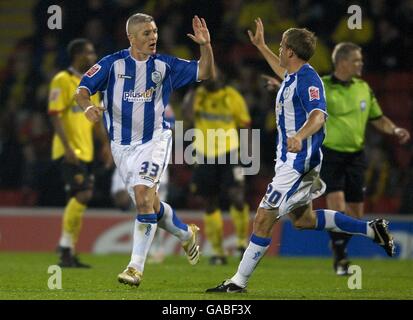 Calcio - Coca-Cola Football League Championship - Watford v Sheffield Mercoledì - Vicarage Road Stadium. Sheffield mercoledì il portiere Graham Kavanagh festeggia con il compagno di squadra Frank Simek Foto Stock