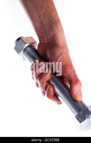 La mano dell'uomo in possesso di una grossa vite. Foto Stock