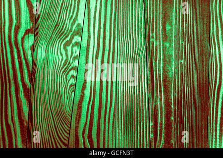 Perfetta luce verde scuro rossiccio irregolari di colore verdastro vecchio e ruvido legname Surface texture di sfondo Foto Stock