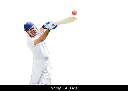 Un indiano giovane cricketer colpendo la sfera cricket gioco di sport Foto Stock