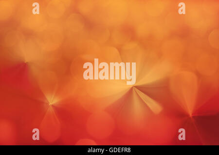 Scintilla colorati e soffiare bokeh di fondo naturale in una meravigliosa atmosfera di fantasia arancio astratto sfondo rosso Foto Stock