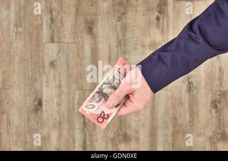 Uno studio concettuale foto di una persona di consegnare Foto Stock