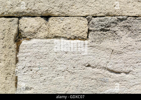 Muro grigio di blocchi di pietra arenaria di forma rettangolare Foto Stock