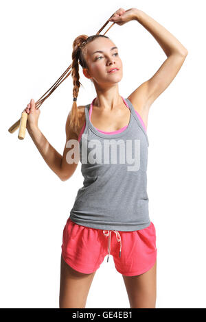 Donna Shapely esercitando con un salto con la corda. Foto Stock