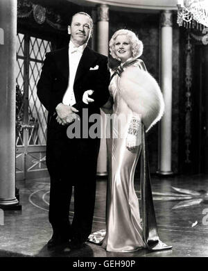 Wallace Beery, Jean Harlow Eine Dame der Gesellschaft impianto, für ein britisches Aristokratenpaar eine Dinner-Party zu geben. Auch Kitty (Jean Harlow) und ihr Mann Dan (Wallace Beery) sind eingeladen. *** Caption locale *** 1933, cena a 8, cena Um Acht Foto Stock