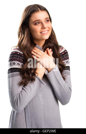 La donna tiene le mani sul petto. Foto Stock