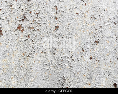 Texture della vecchia vernice incrinata sul muro di cemento Foto Stock