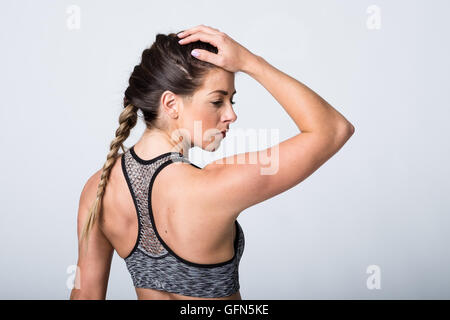 Donna in abbigliamento fitness Foto Stock