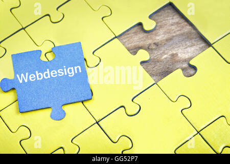 I pezzi del puzzle con la parola Webdesign Foto Stock