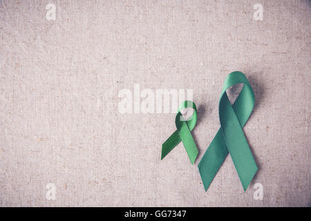 Nastri verde spazio copia sfondo tonificante, cancro consapevolezza, fegato, cancro del rene consapevolezza Foto Stock