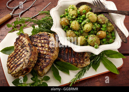 La carne di maiale patate Piselli Foto Stock