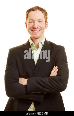 Sorridente imprenditore di successo con le braccia incrociate Foto Stock