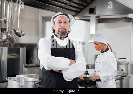Donna ristorante cucina Foto Stock