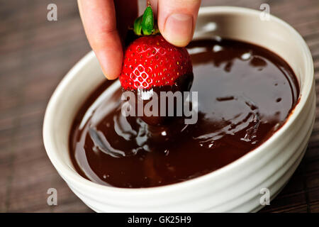 Mano di fragole dolci Foto Stock