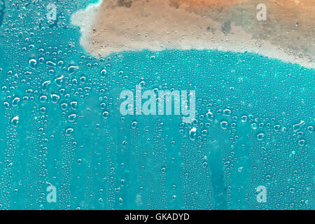 Superficie blu con bolle e schiuma Foto Stock