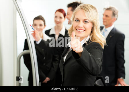 Business - team in un ufficio Foto Stock