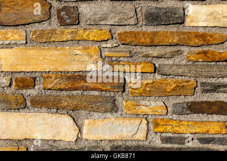 Parte di un muro di pietra, per background o texture Foto Stock