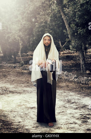 Gesù Cristo e la moltiplicazione dei pani e dei pesci. Foto Stock