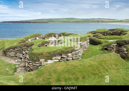 Skara Brae, una pietra-costruito villaggio neolitico situato sulla baia di Skaill sulla costa occidentale delle isole di Orkney in Scozia. Foto Stock