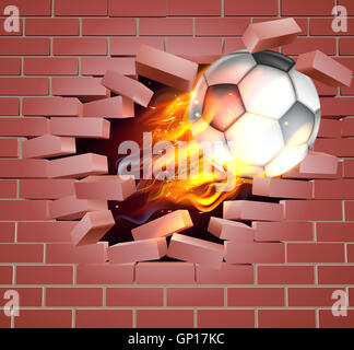 Una illustrazione di una masterizzazione flaming Soccer Football palla sul fuoco la lacerazione di una foro passante attraverso una parete di mattoni Foto Stock