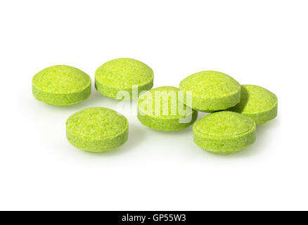 Verde Giallo pillole cerchio vicino la fotografia macro del farmaco su sfondo bianco Foto Stock