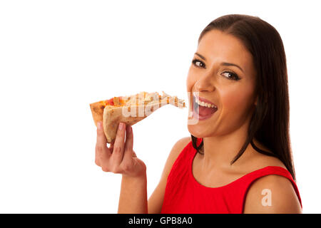 Donna di mangiare gustosi pezzi di pizza. Malsana pasto veloce. Foto Stock