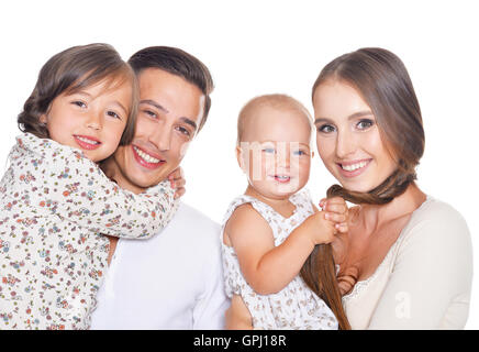 La famiglia felice di quattro su bianco Foto Stock