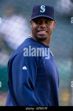 Seattle Mariners right fielder Ken Griffey Jr., left, hugs left fielder  Michael Saunders during a spring training baseball practice Thursday, Feb.  25, 2010, in Peoria, Ariz. (AP Photo/Charlie Neibergall Stock Photo - Alamy