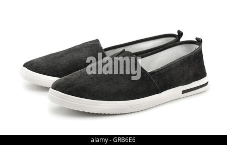 Coppia di tela nero slittamento su scarpe casual isolato su bianco Foto Stock